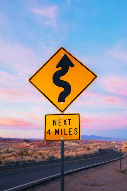 Winding road sign representing financial journey
